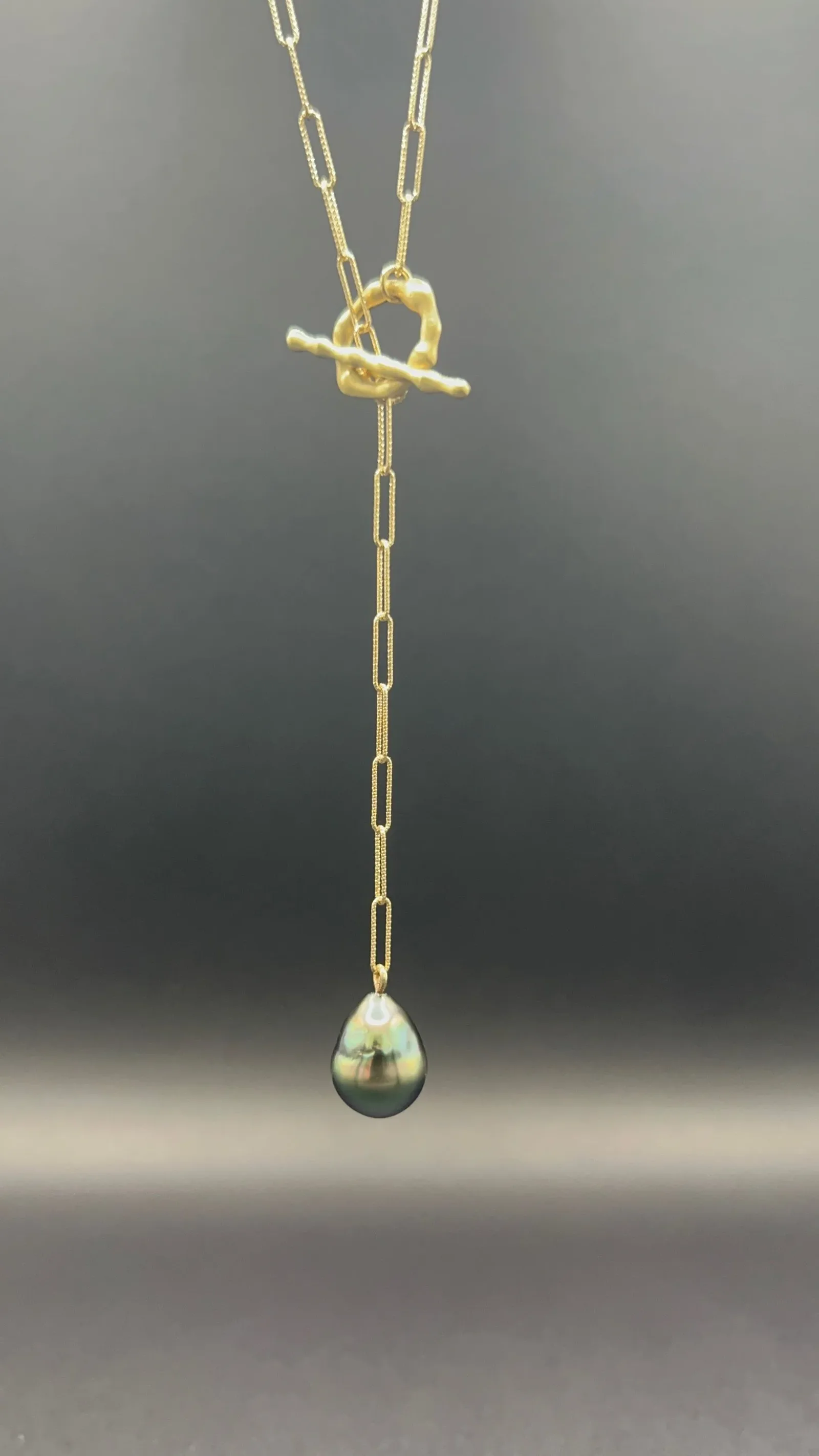Gold paperclip chain lariat necklace with toggle clasp and dark Tahitian pearl drop pendant
